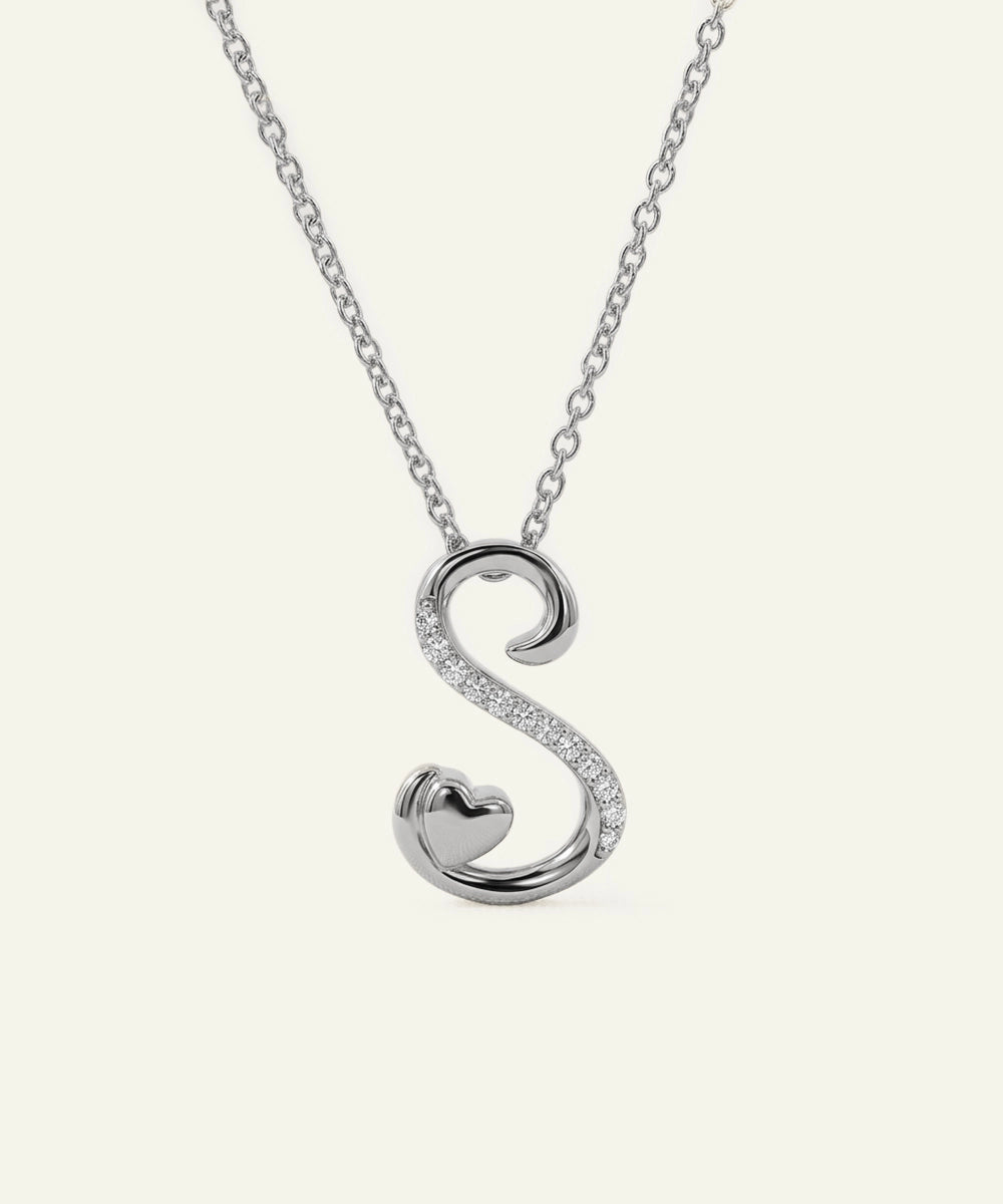 Silver necklace with a 'S' shaped pendant on a white background