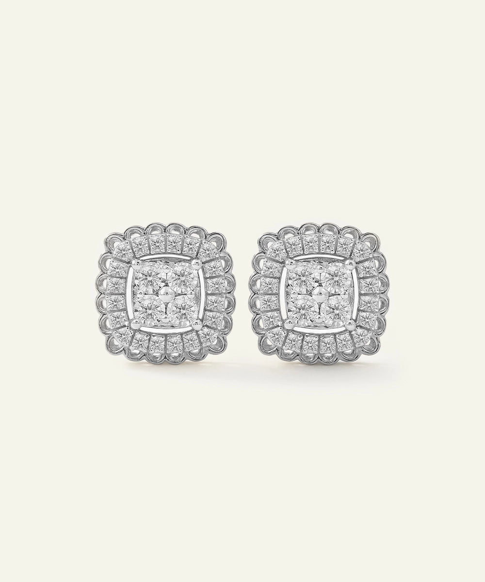 Pair of diamond earrings on a light gray background
