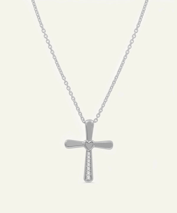 Silver cross necklace on a white background