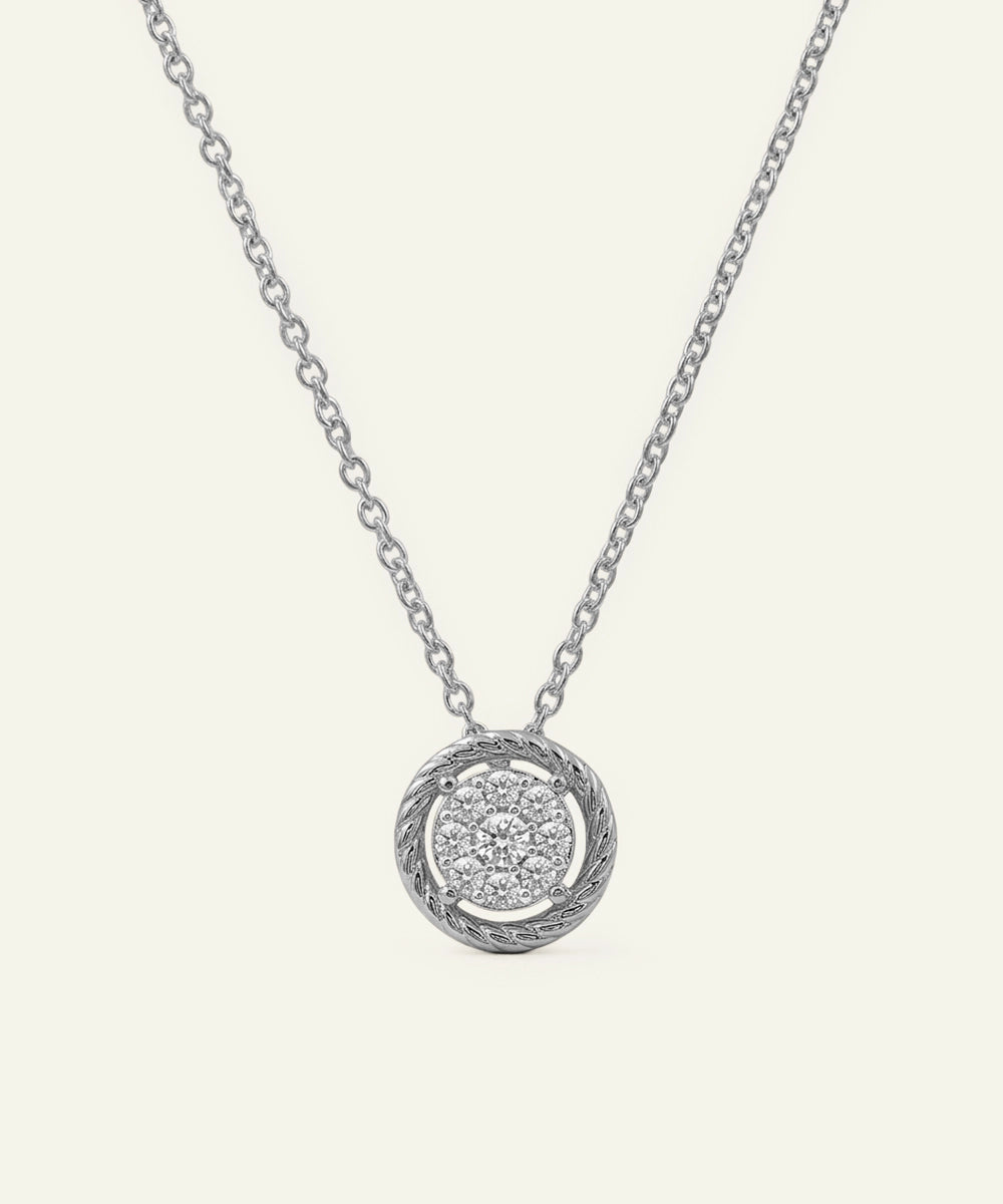 Silver necklace with a round pendant on a white background