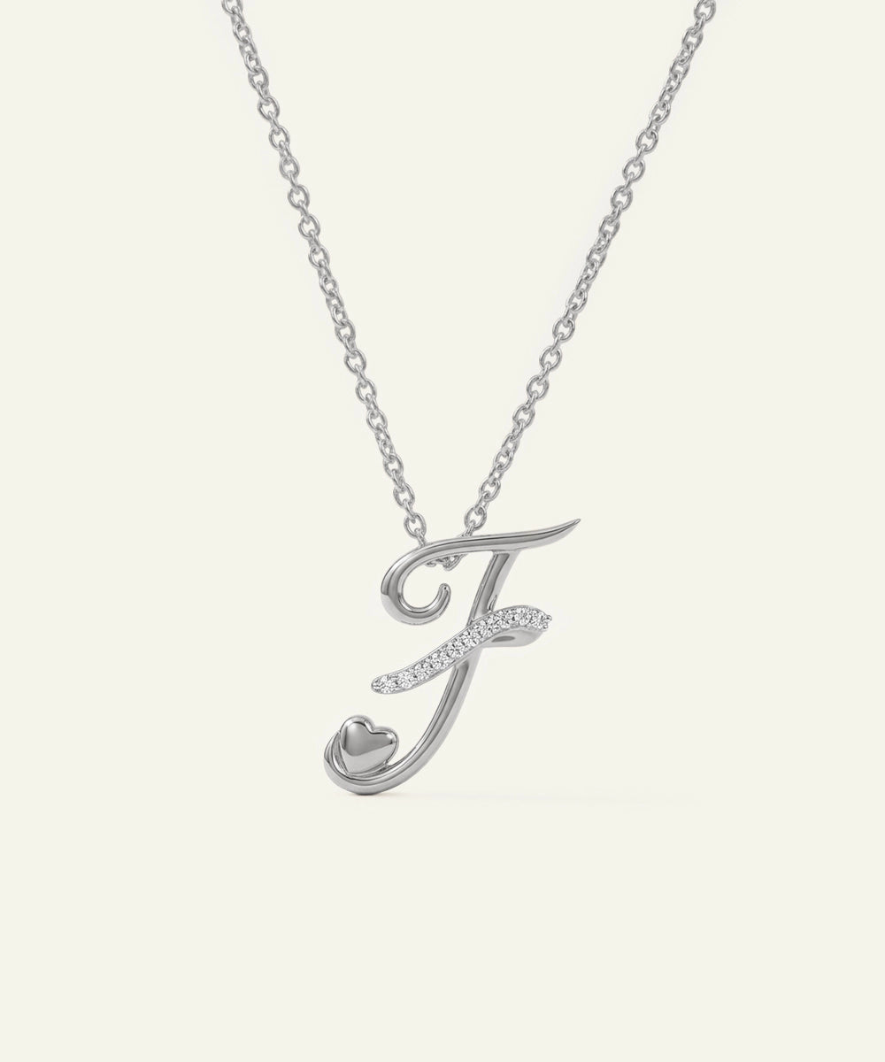 Silver necklace with a letter 'J' pendant on a white background