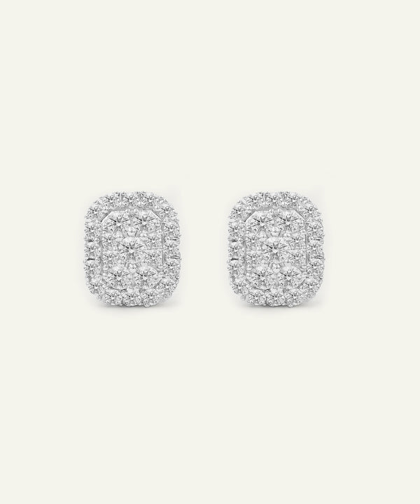 Pair of silver earrings with a textured design on a white background