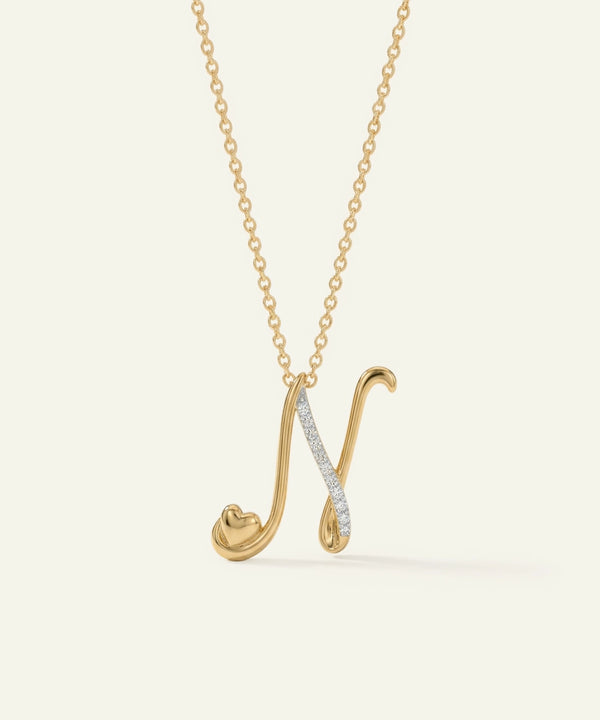 Gold necklace with a unique pendant on a light beige background