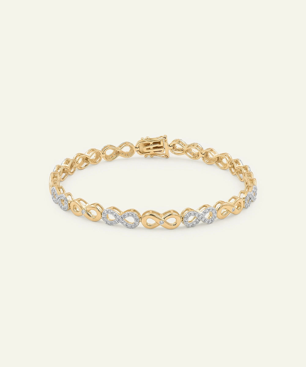 Gold bracelet with interlocking links on a light gray background
