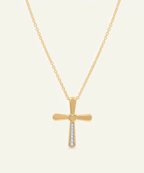 Gold cross necklace with heart detail and small diamonds on a white background
