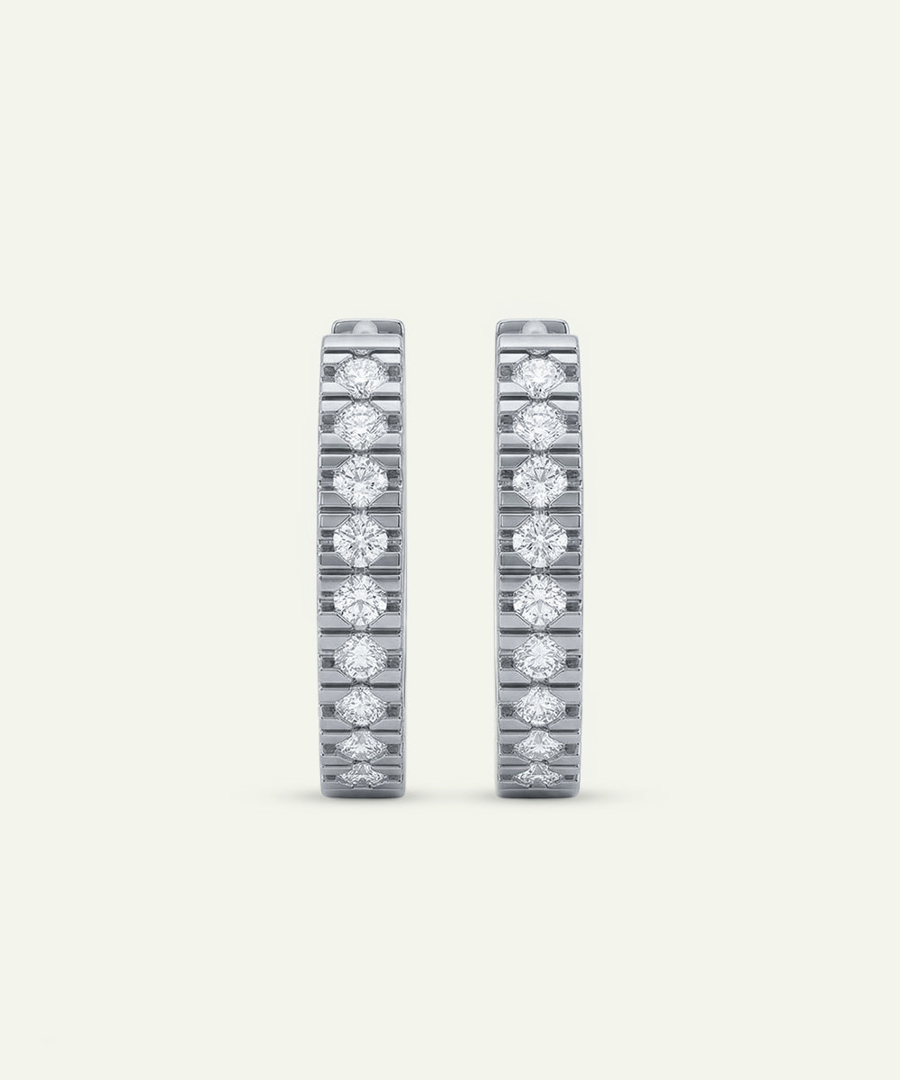 Pair of diamond eternity bands on a light gray background