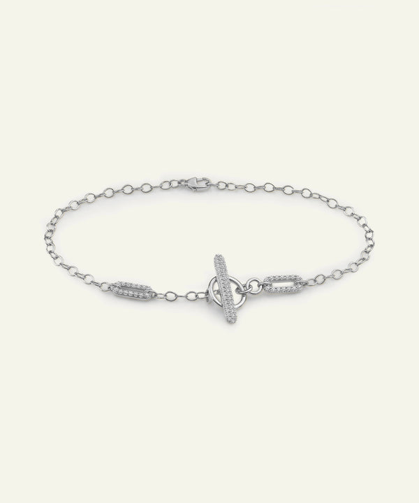 Silver bracelet with a unique clasp design on a white background