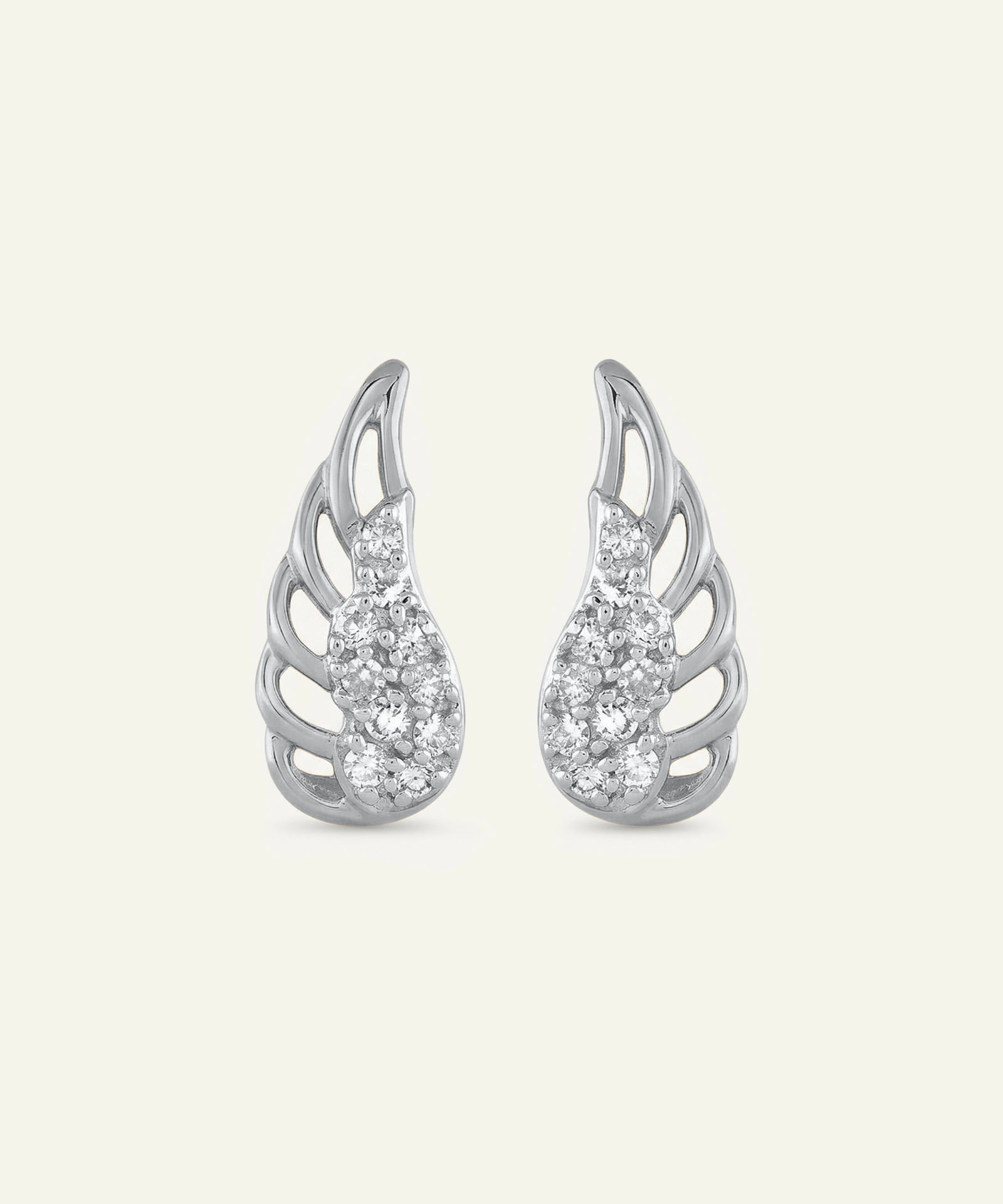 Silver wing-shaped earrings with gemstones on a light gray background