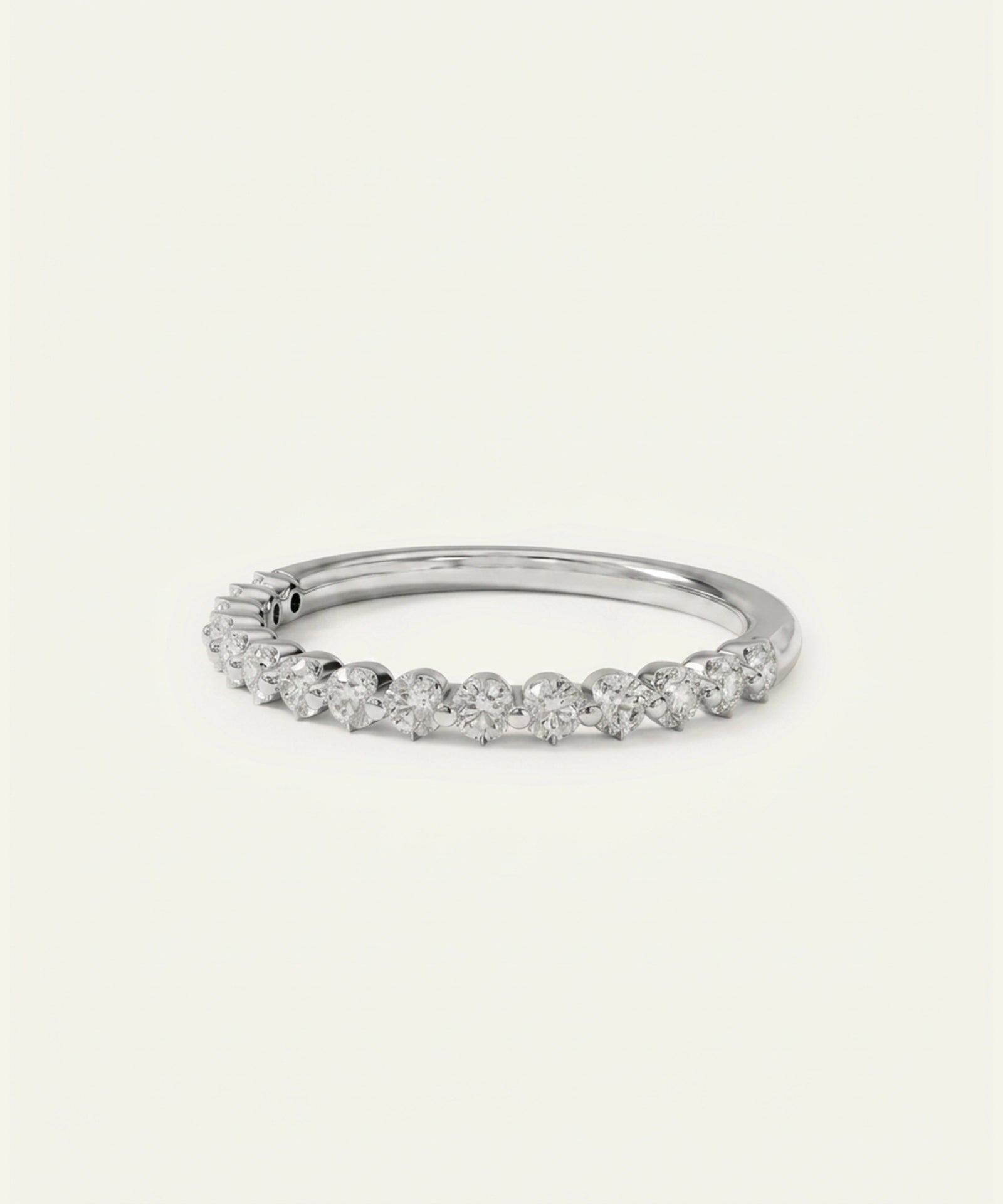 Rose gold ring with small diamonds on a white background