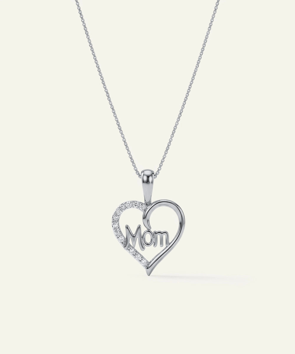 Heart-shaped pendant with 'Mom' engraving on a white background