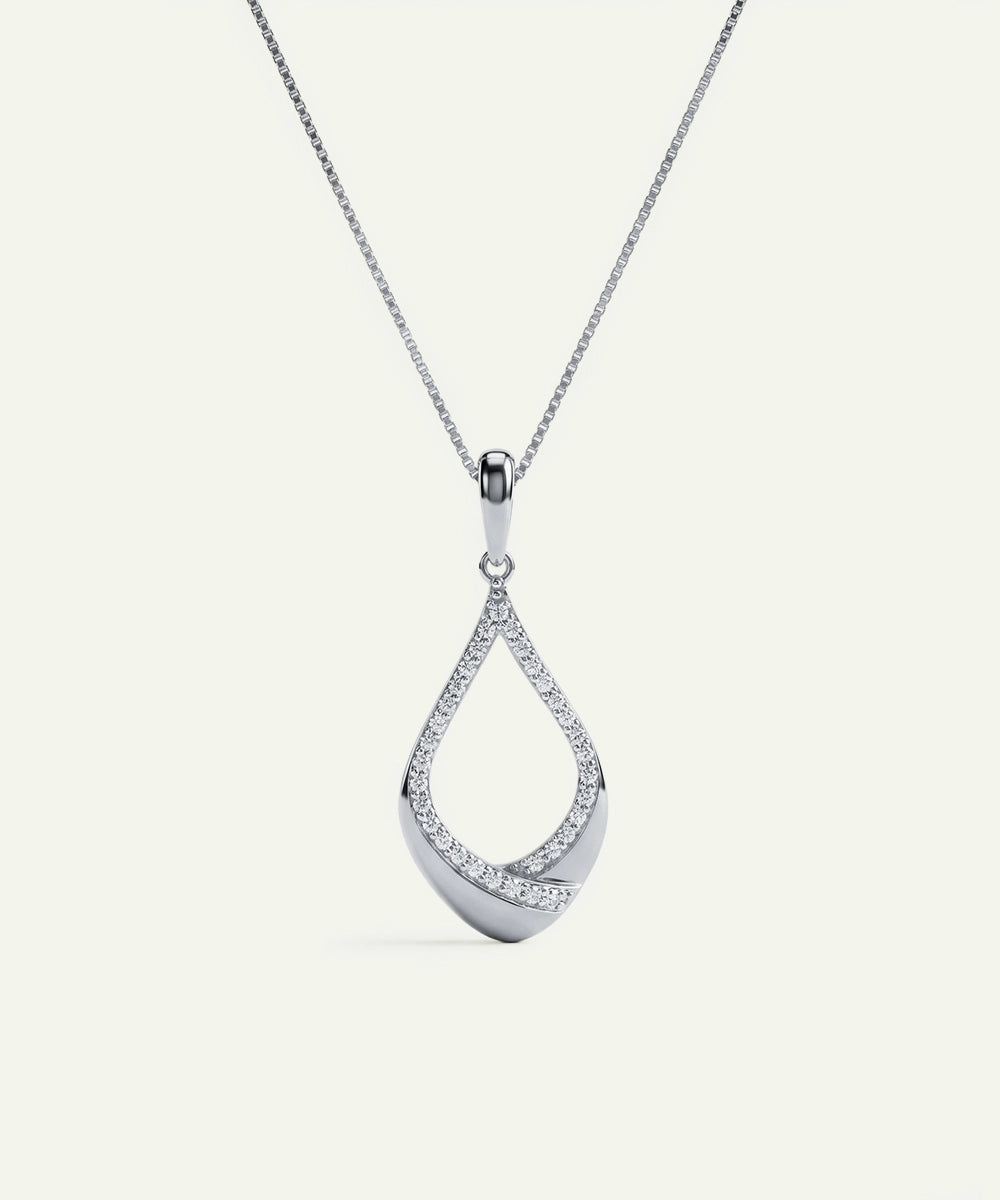 Silver teardrop-shaped pendant on a chain against a white background