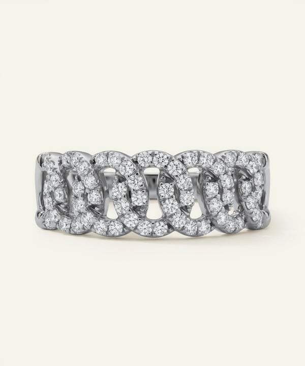 Silver ring with diamond accents on a white background
