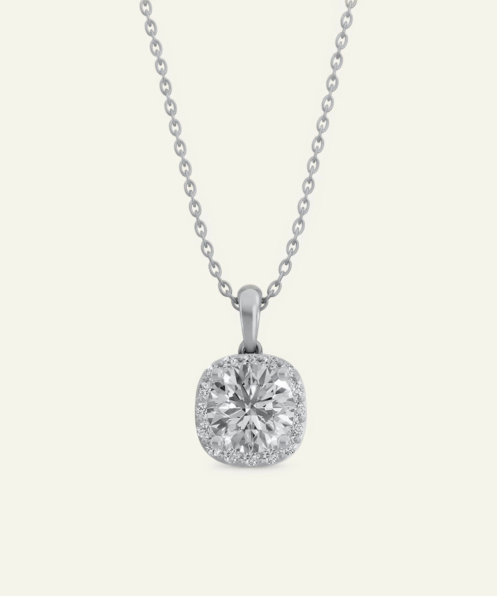 Diamond pendant on a chain against a white background