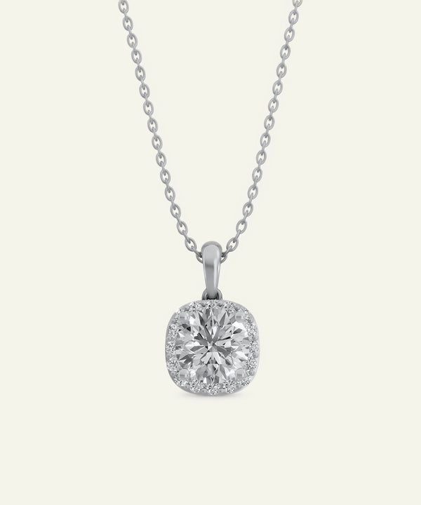 Diamond pendant on a chain against a white background