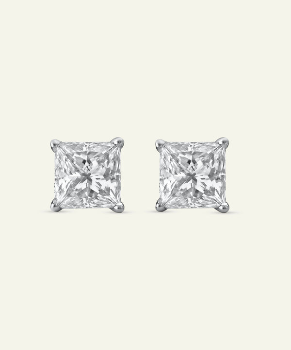 Pair of square-cut stud earrings on a light gray background
