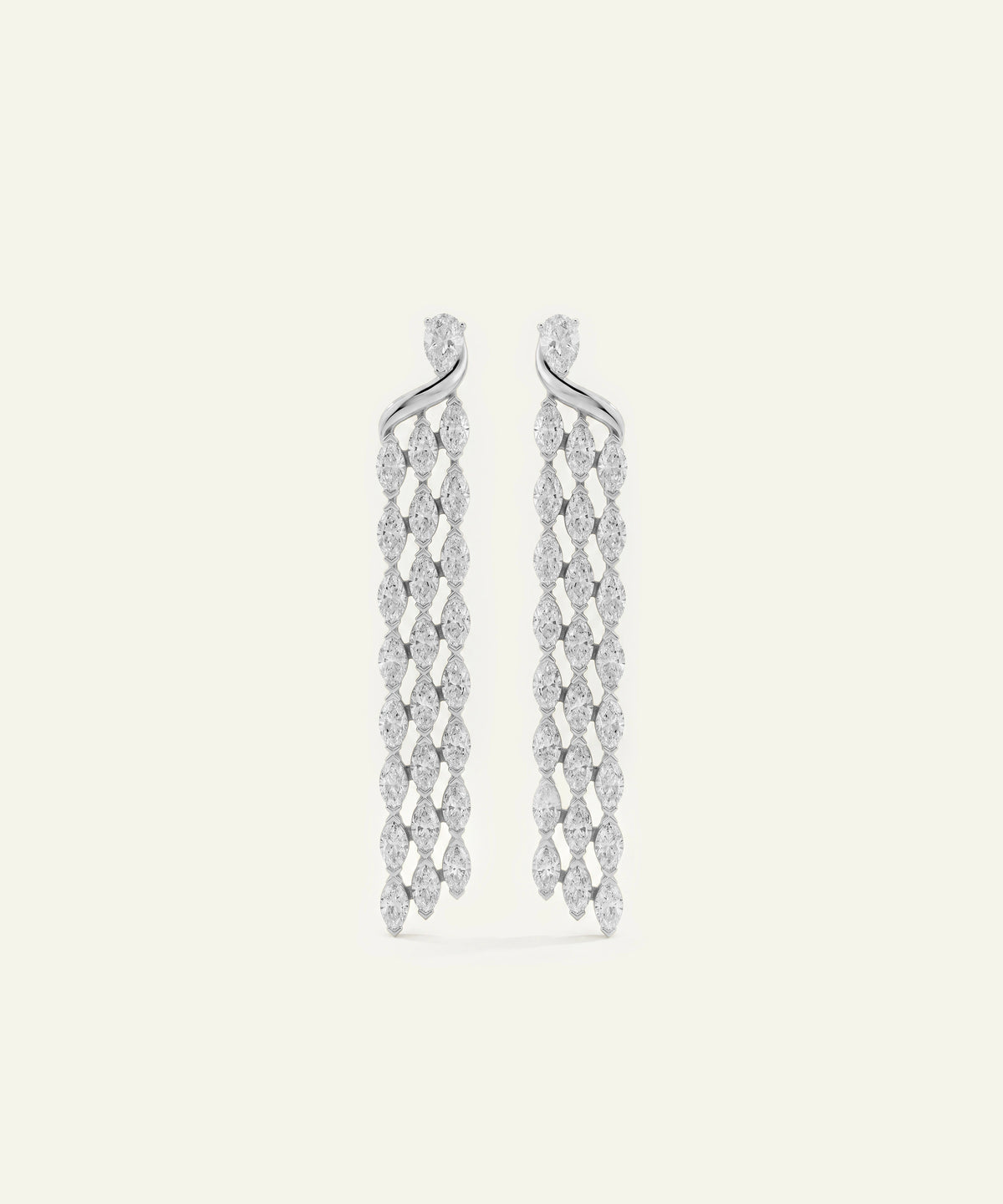A pair of long, dangling earrings with a silver-tone twisted wire design and rows of small marquise-cut clear stones, shown on a plain off-white background.