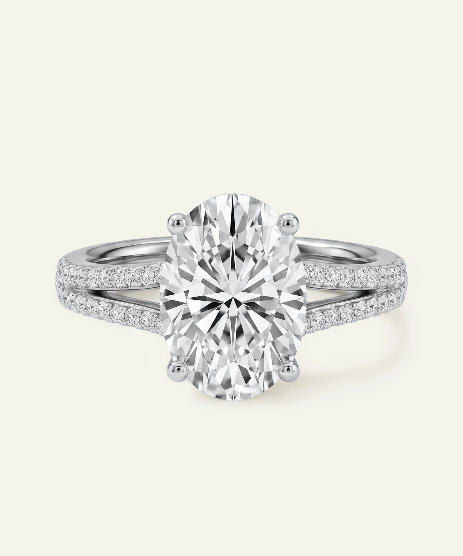 Oval-cut diamond engagement ring with a pavé split-shank band.