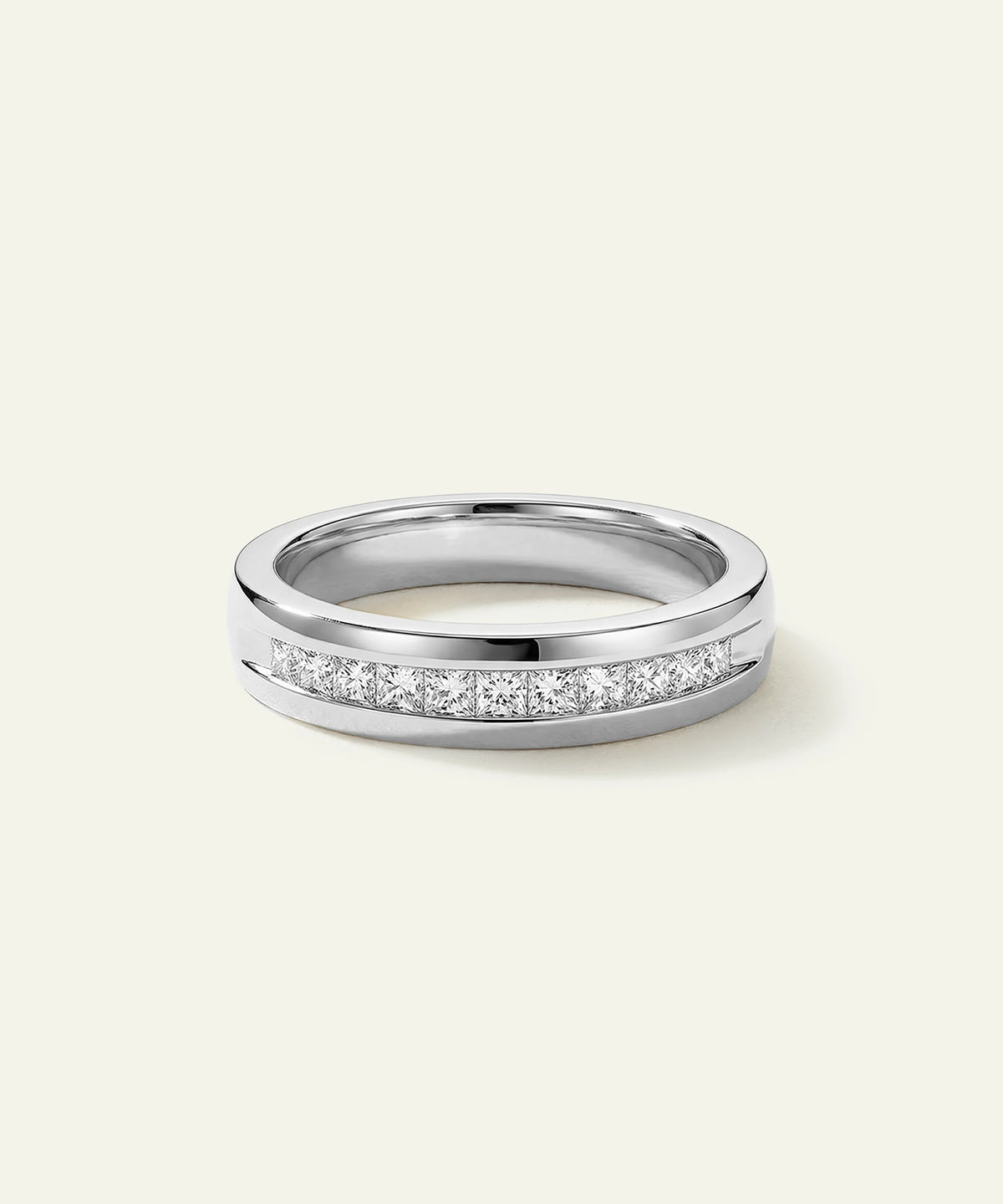 Ovani® round channel-set natural diamond men's wedding band at Valliani Jewelers