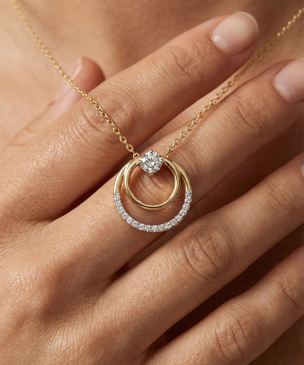 Gold and diamond ring on a hand