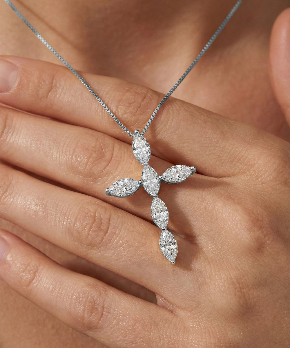 Diamond necklace on a hand with a soft background