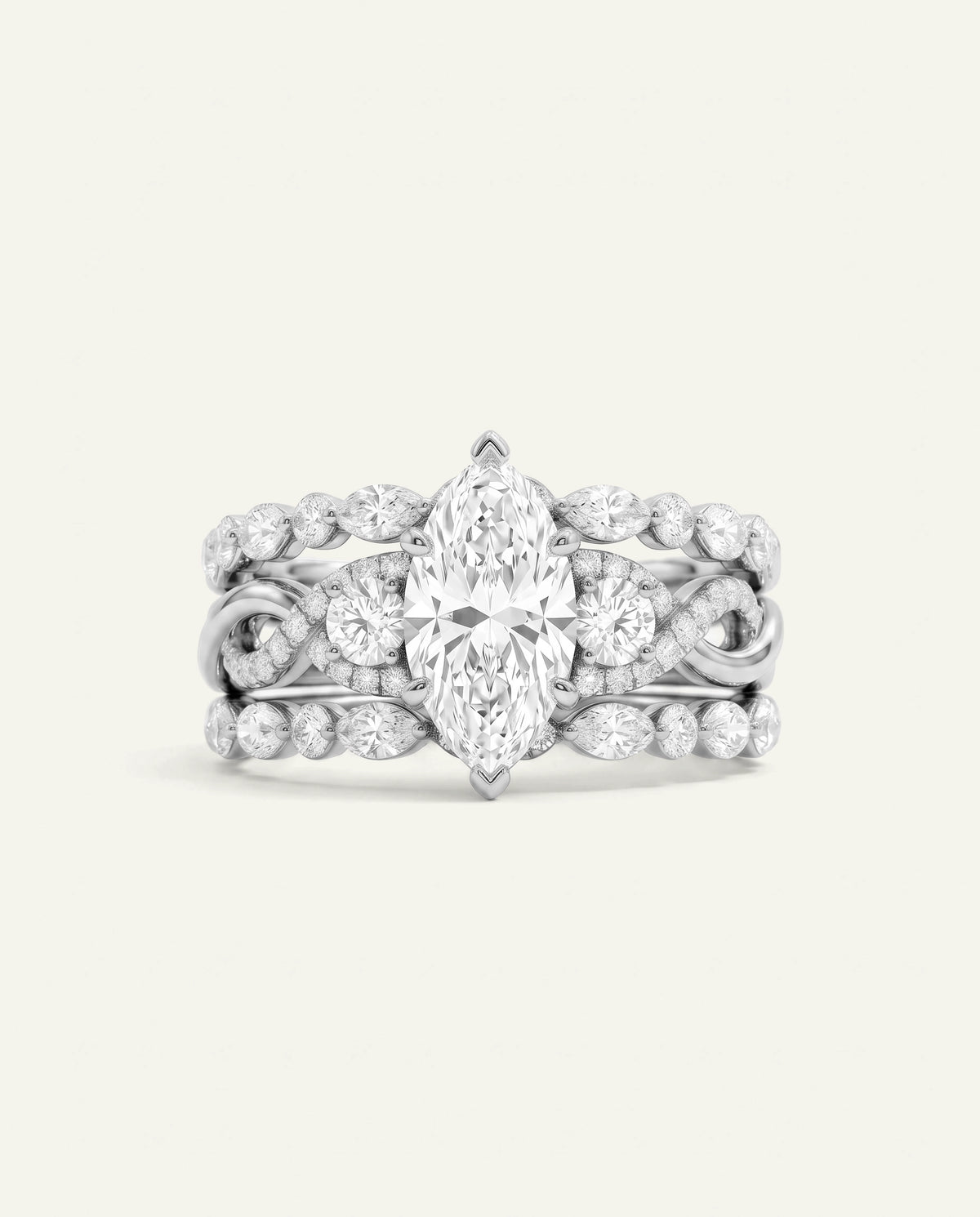 A silver-toned diamond ring set featuring a marquise-cut center stone surrounded by round and oval diamonds, with additional diamonds along the shoulders, shown on a light cream background.