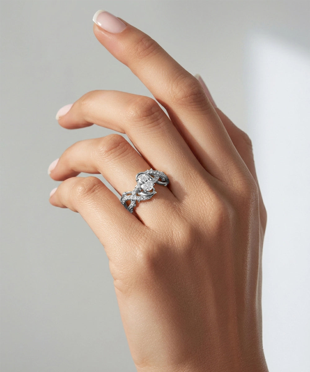 Hand wearing a diamond ring on a neutral background