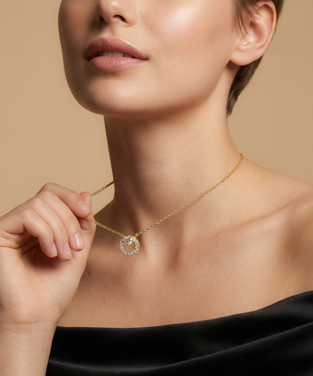 Woman wearing a diamond necklace against a beige background
