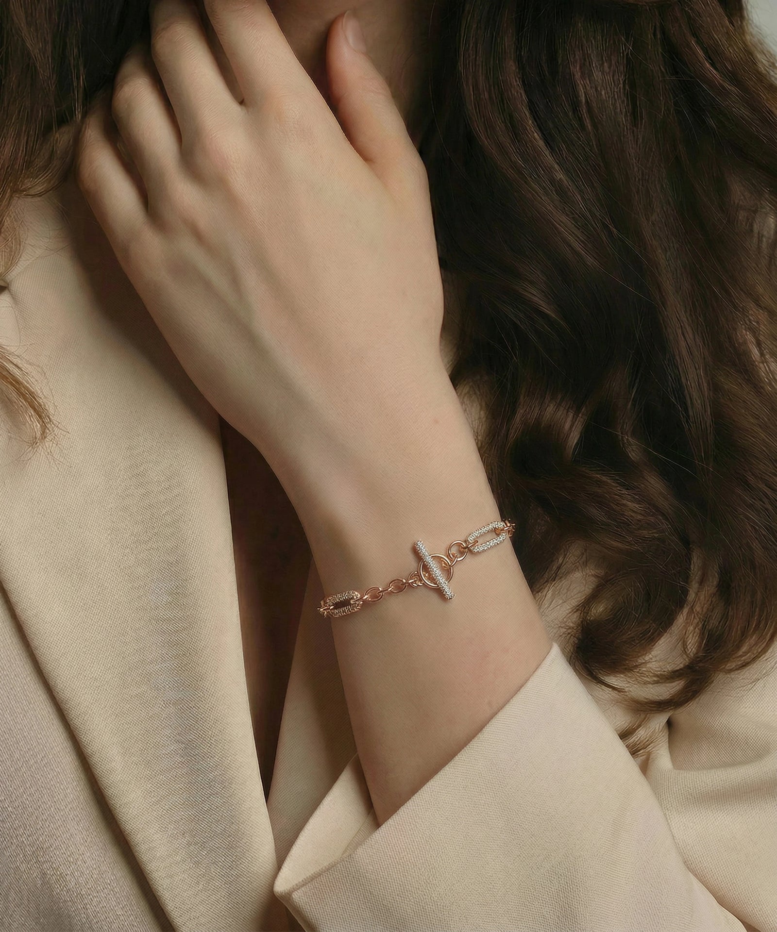 Person wearing a delicate bracelet on a soft background