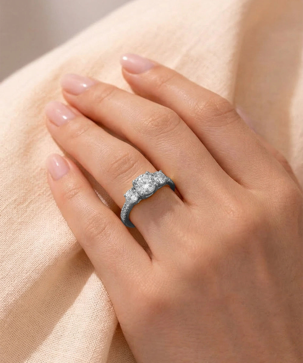 Diamond ring on a hand with a soft beige background