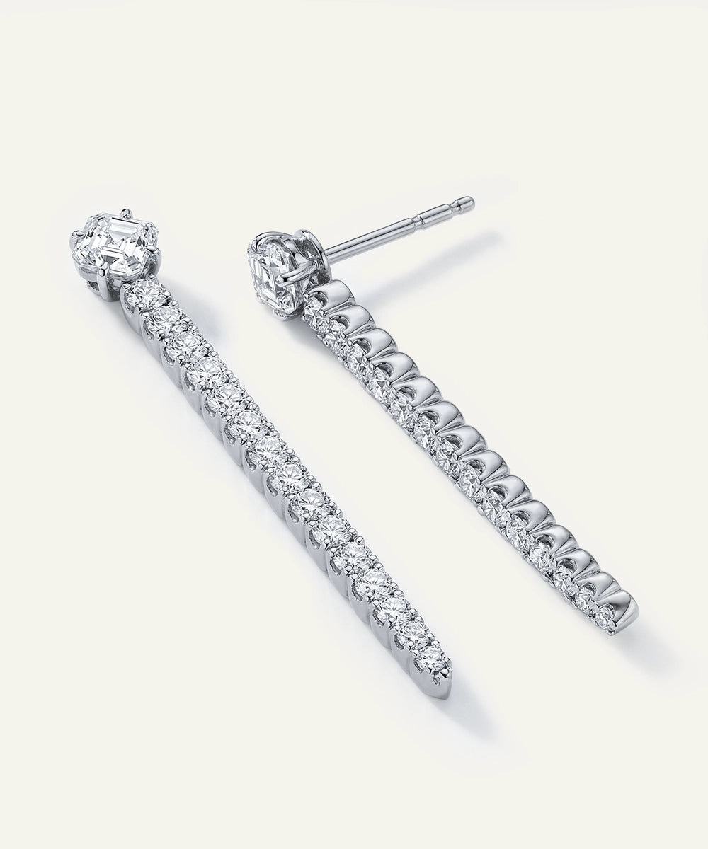 White gold quad princess-cut diamond bridal engagement ring and band set.