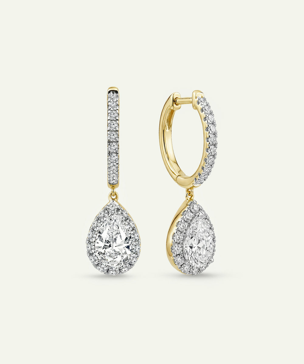 Gold and silver hoop earrings on a white background