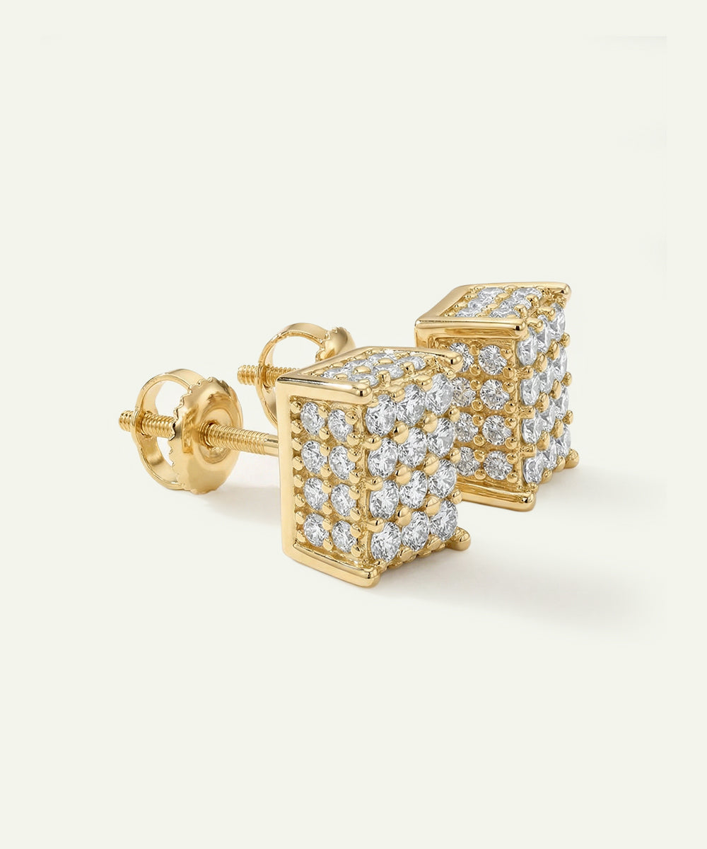 Gold square-shaped earrings with diamond accents on a white background