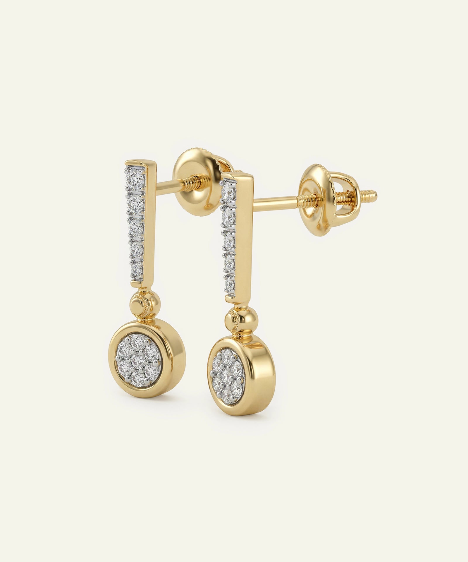 Gold earrings with diamond accents on a white background