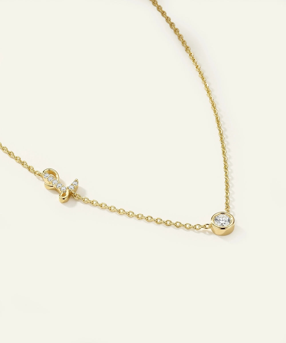 Gold necklace with diamond pendants on a white background