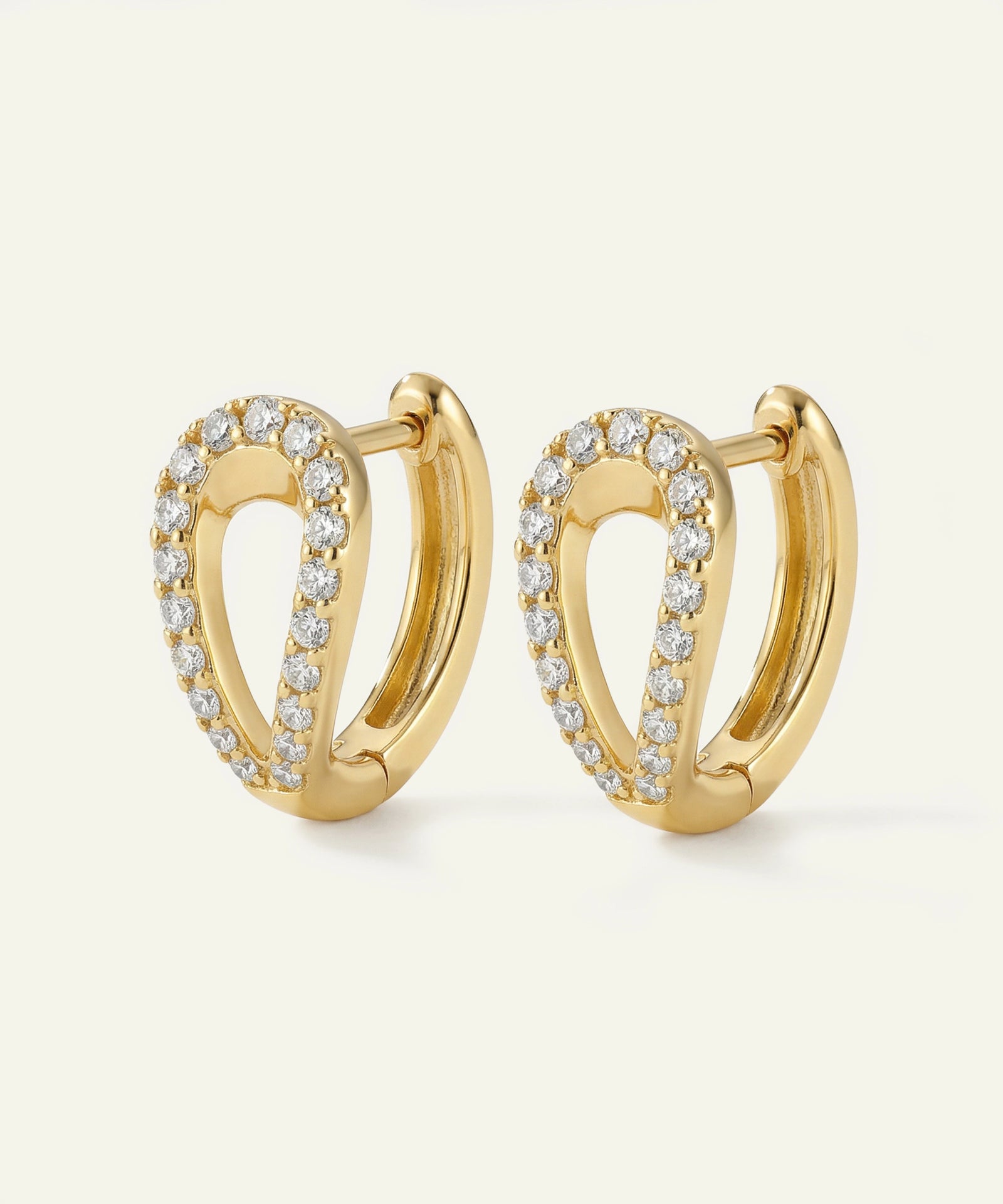 Gold hoop earrings with diamond accents on a white background