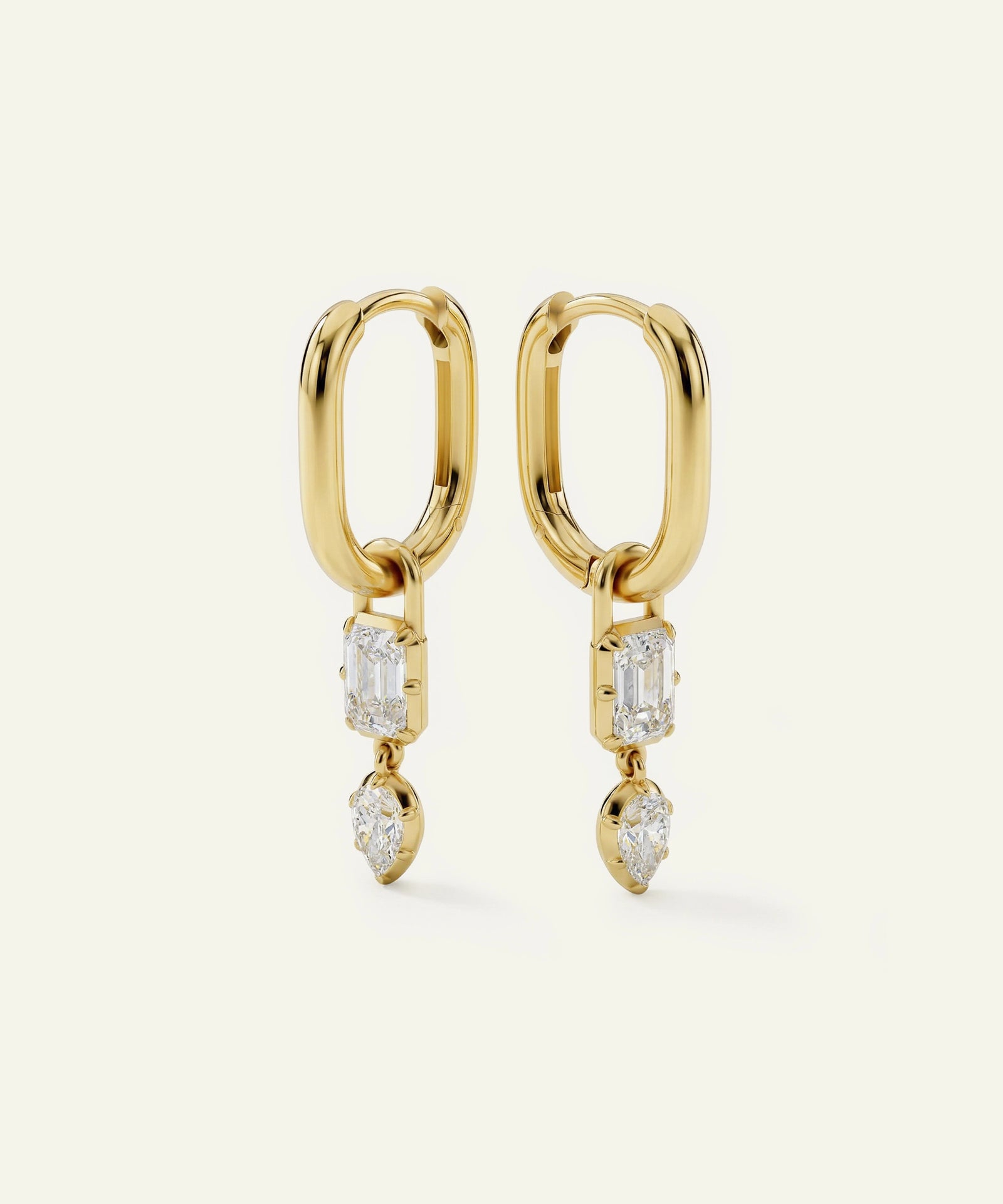 Gold hoop earrings with diamond accents on a white background