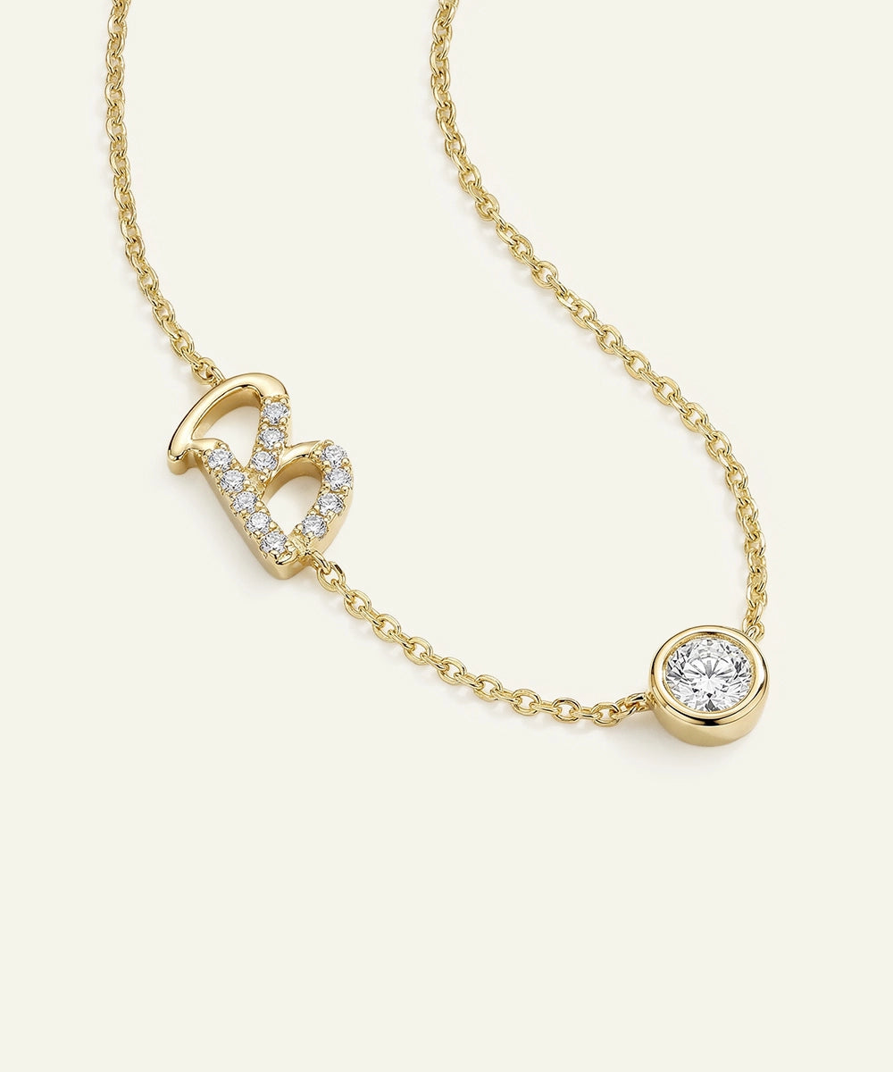 Gold necklace with diamond pendants on a white background