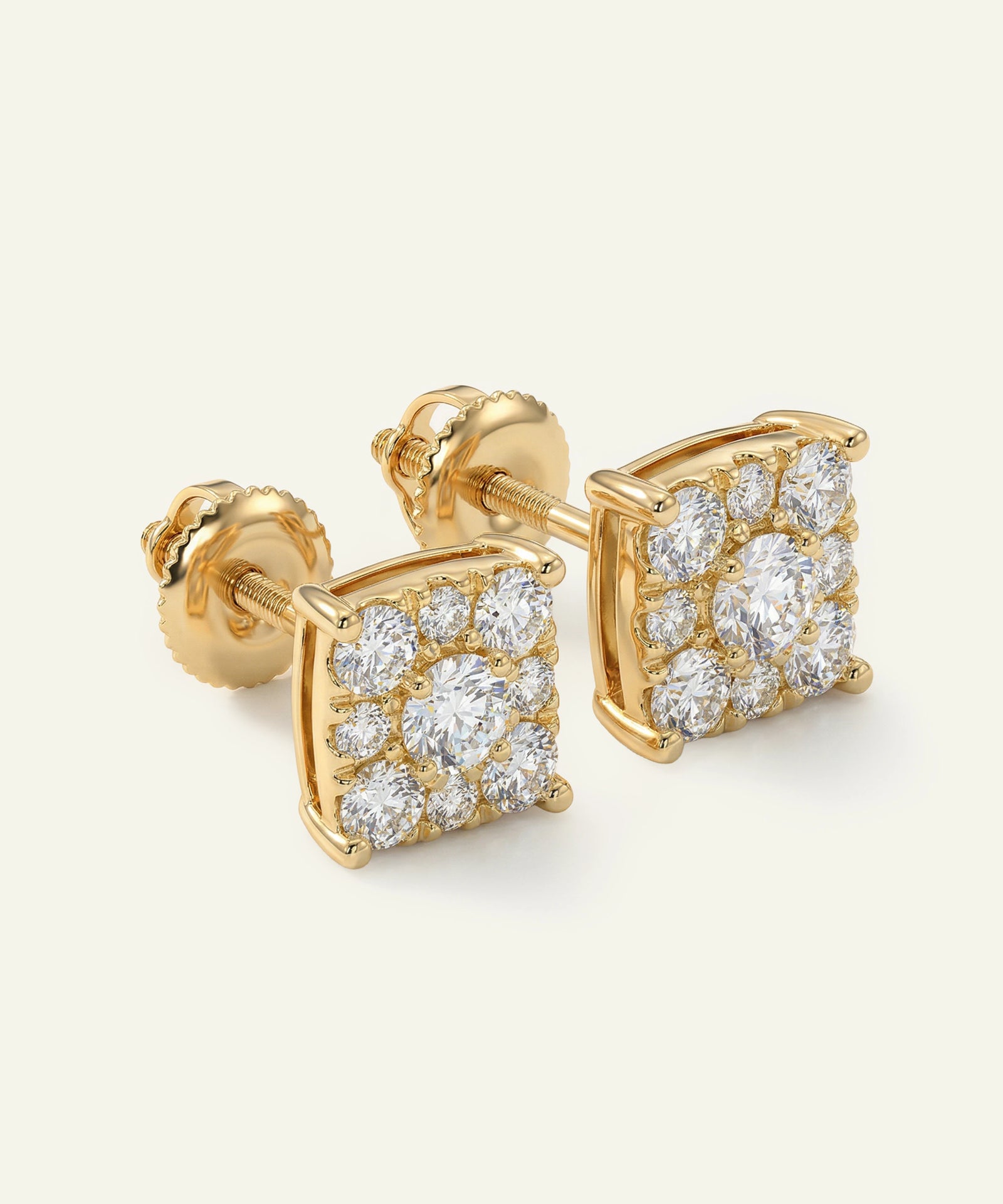 Gold earrings with diamond accents on a white background