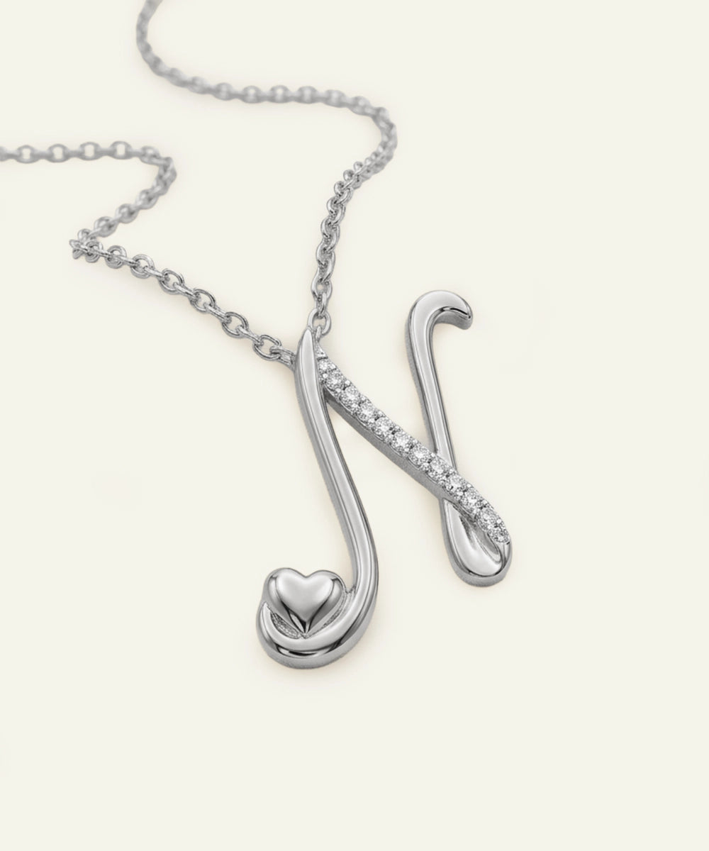 Silver necklace with a unique pendant on a white background