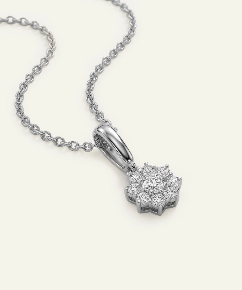 Diamond pendant on a chain against a white background