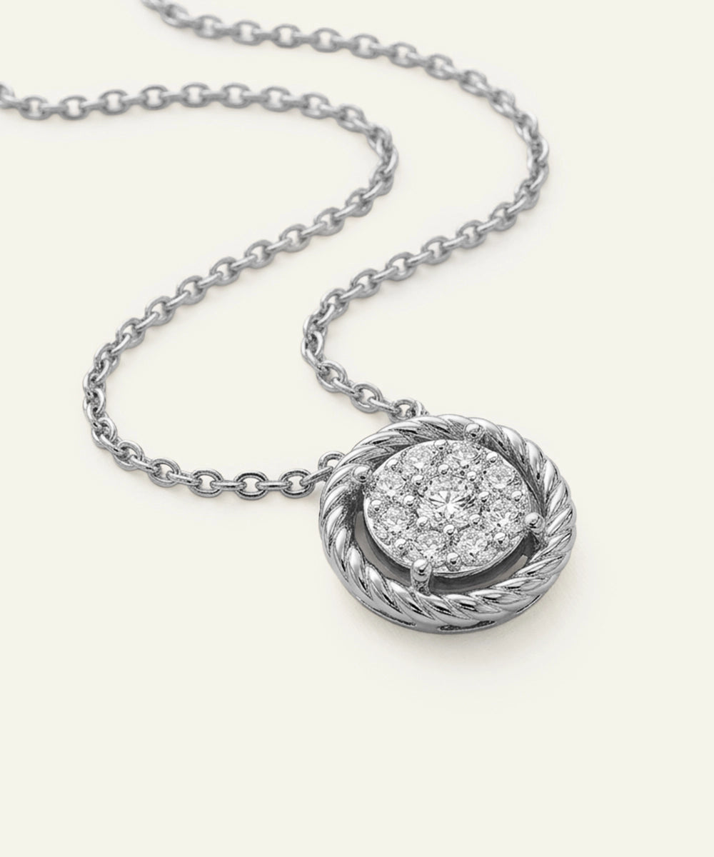 Silver necklace with a diamond pendant on a white background