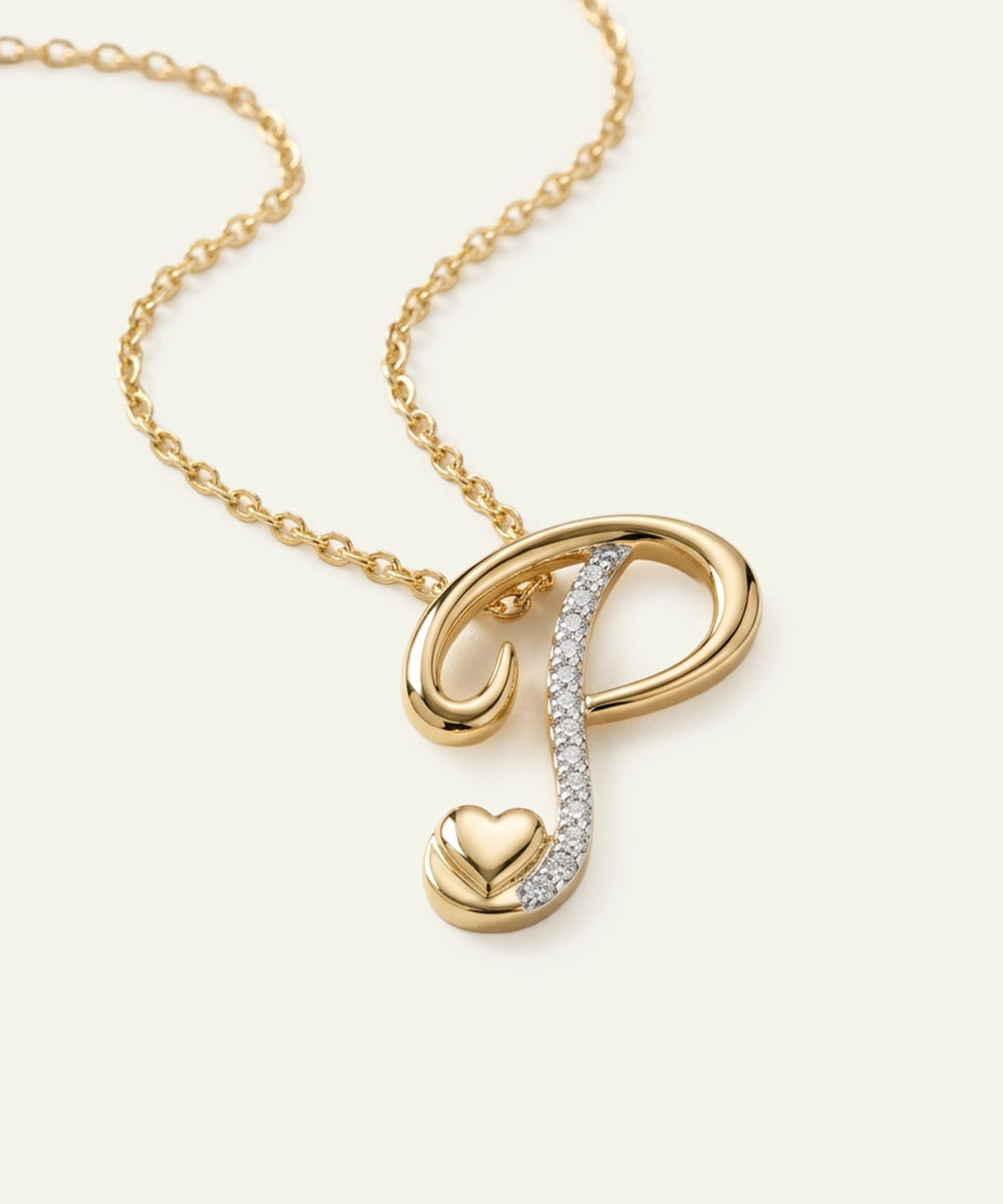 Gold necklace with a heart and infinity symbol pendant on a light beige background