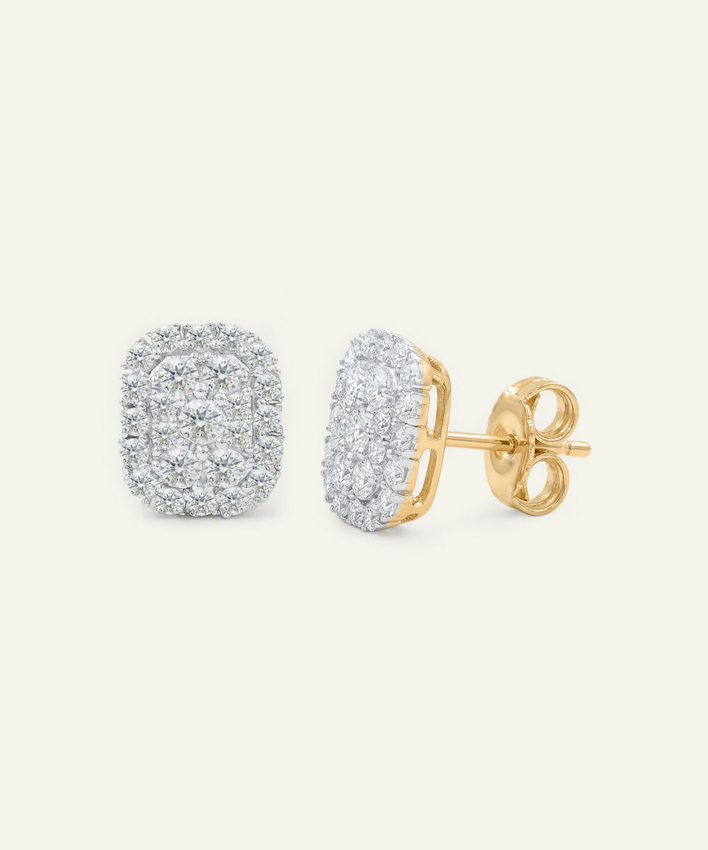 Gold and silver earrings on a white background