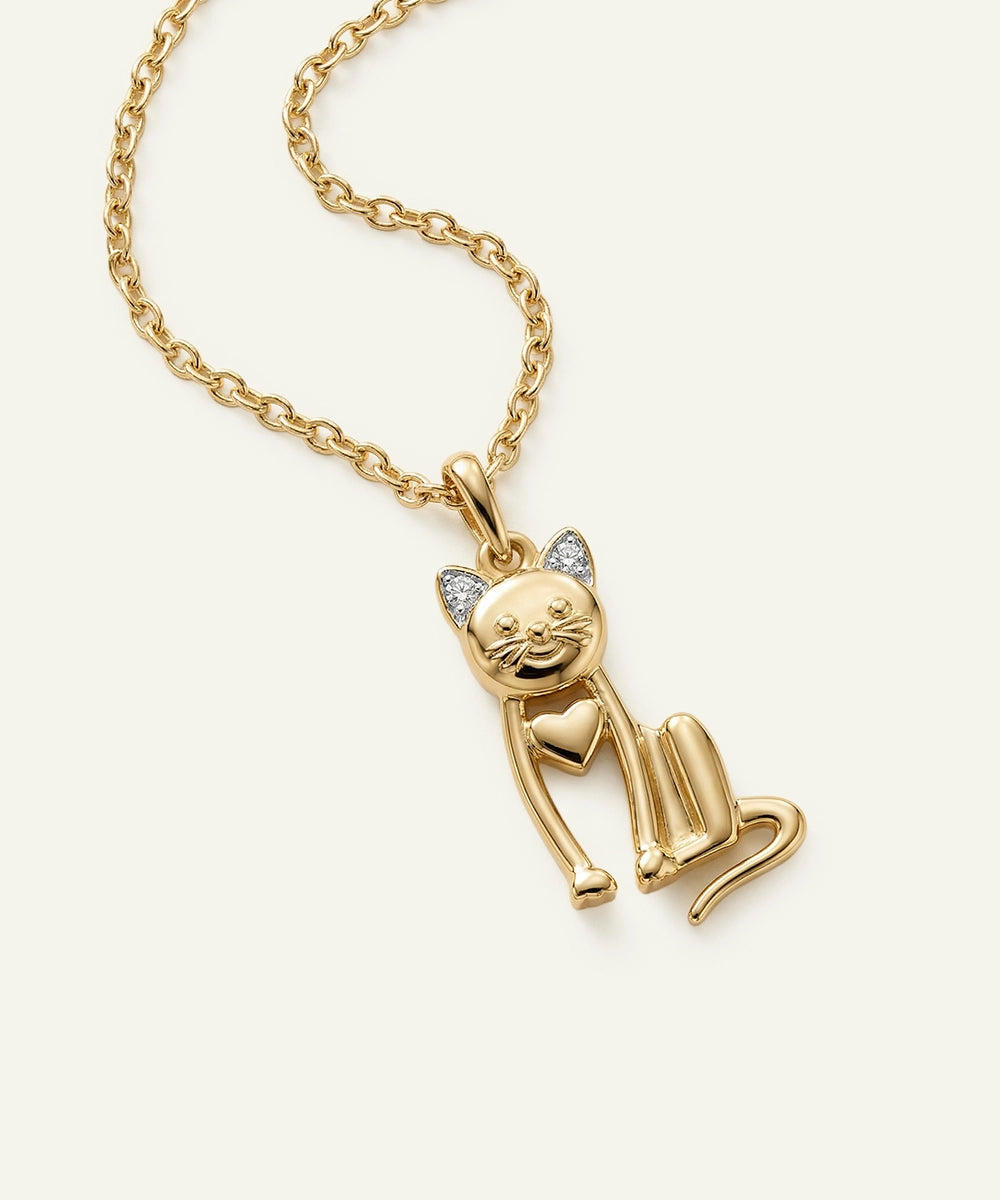 Gold cat-shaped pendant on a chain against a white background