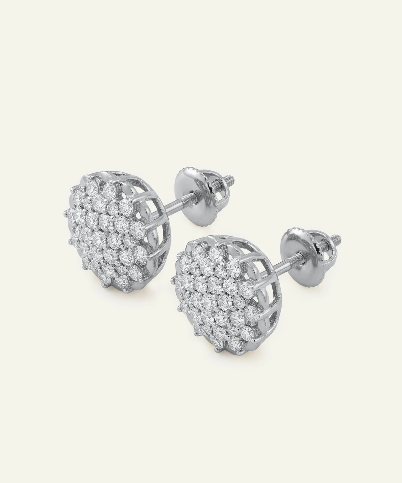 Silver heart-shaped earrings with clear stones on a white background