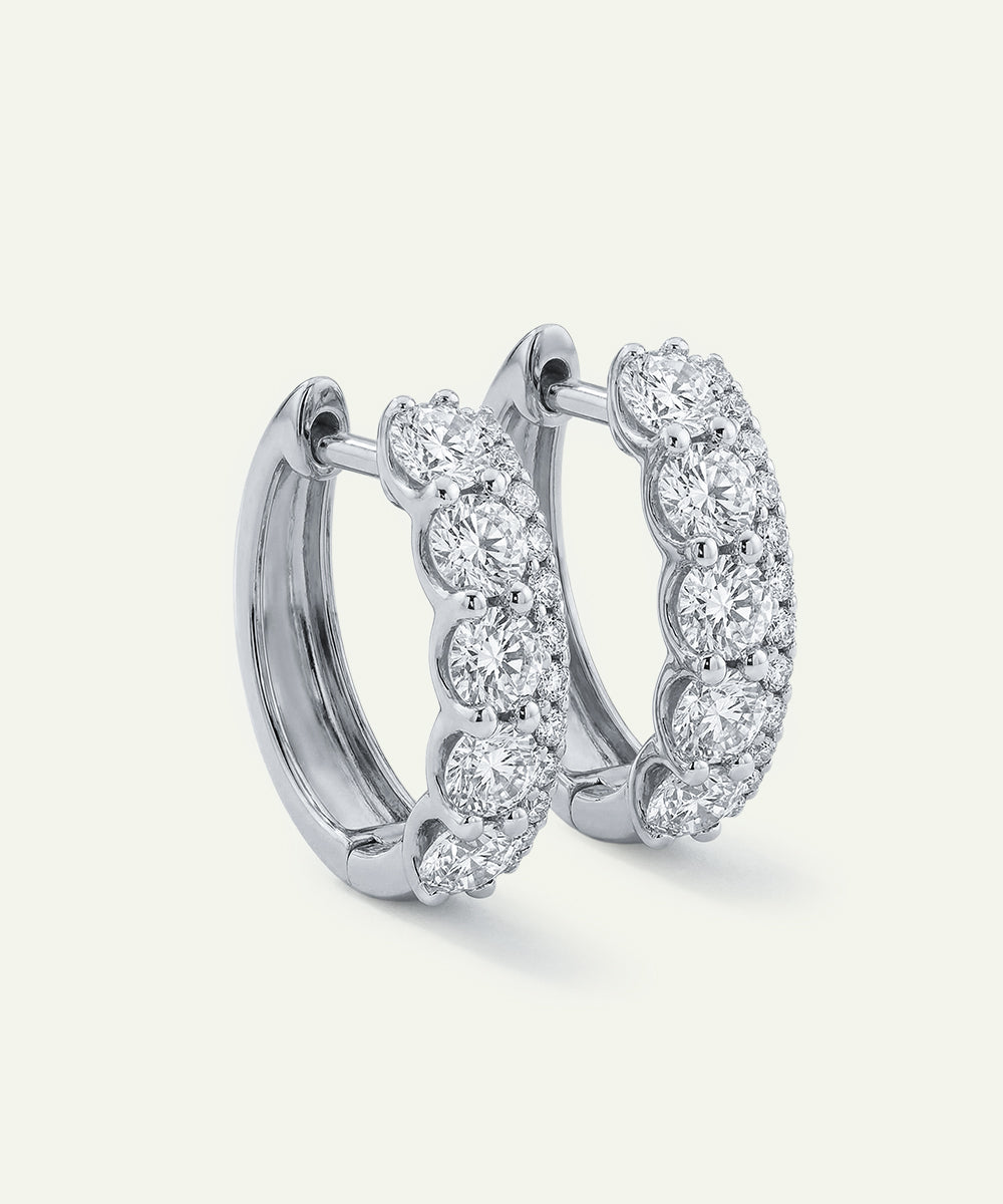 Diamond hoop earrings on a white background