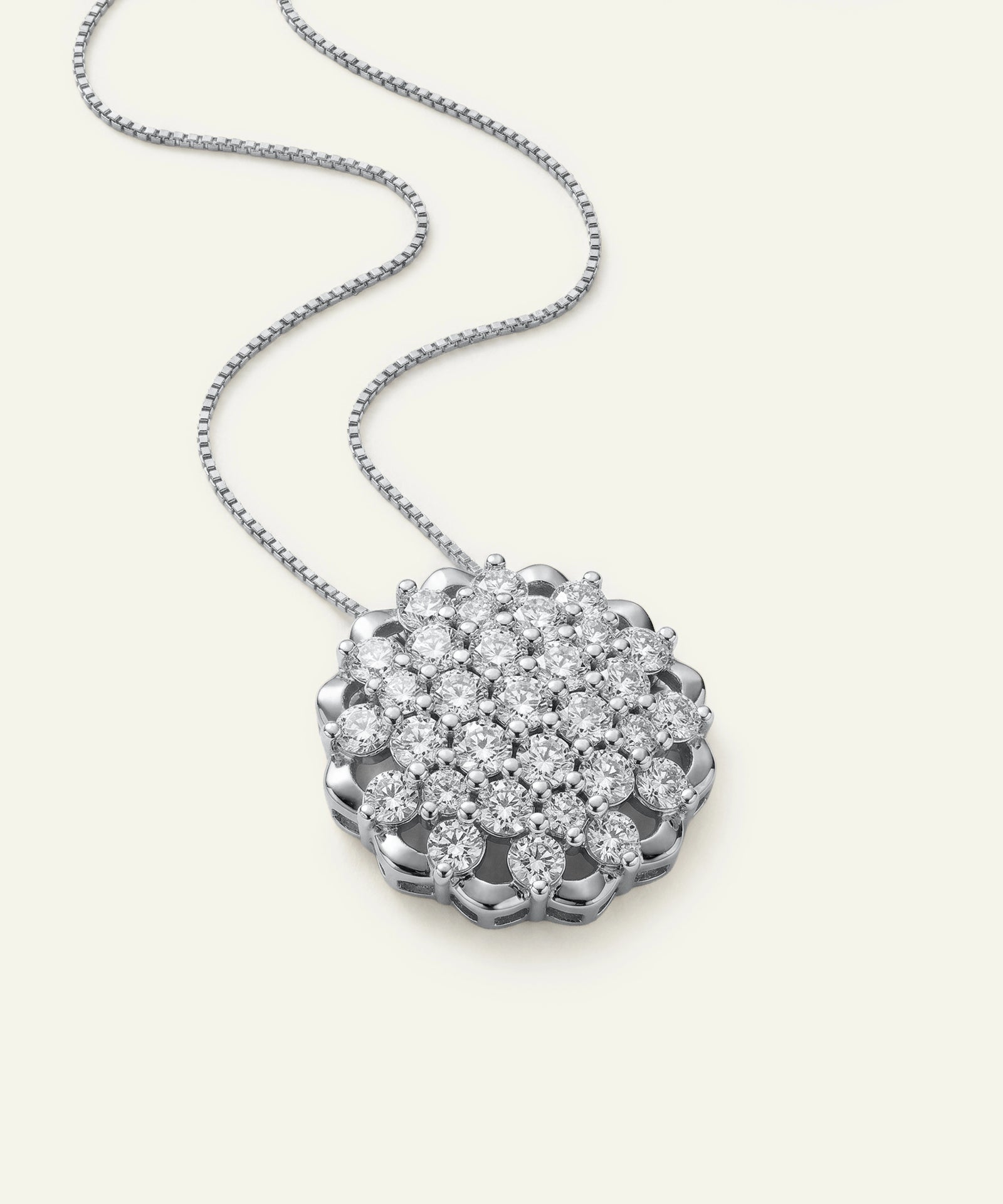 Diamond necklace with a floral pendant on a white background