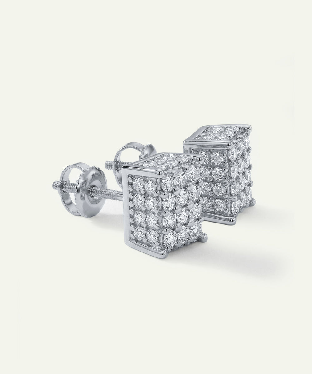 Pair of diamond square stud earrings on a light gray background