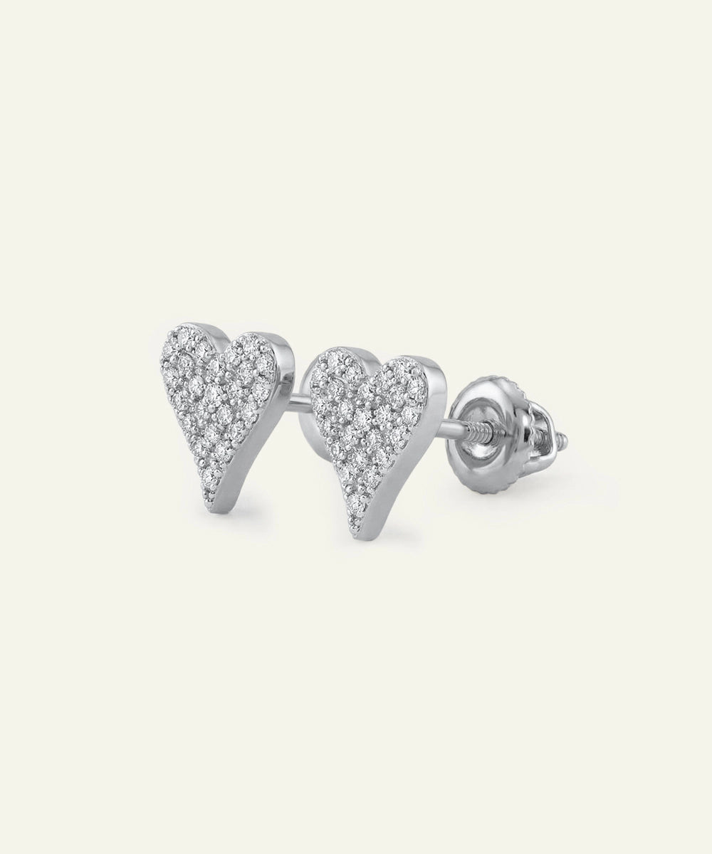 Heart-shaped earrings with clear stones on a white background
