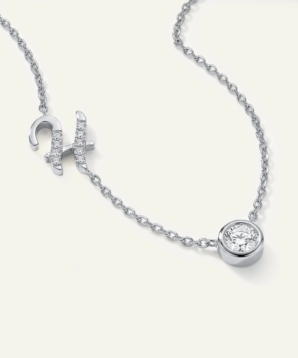 Silver necklace with a pendant on a white background